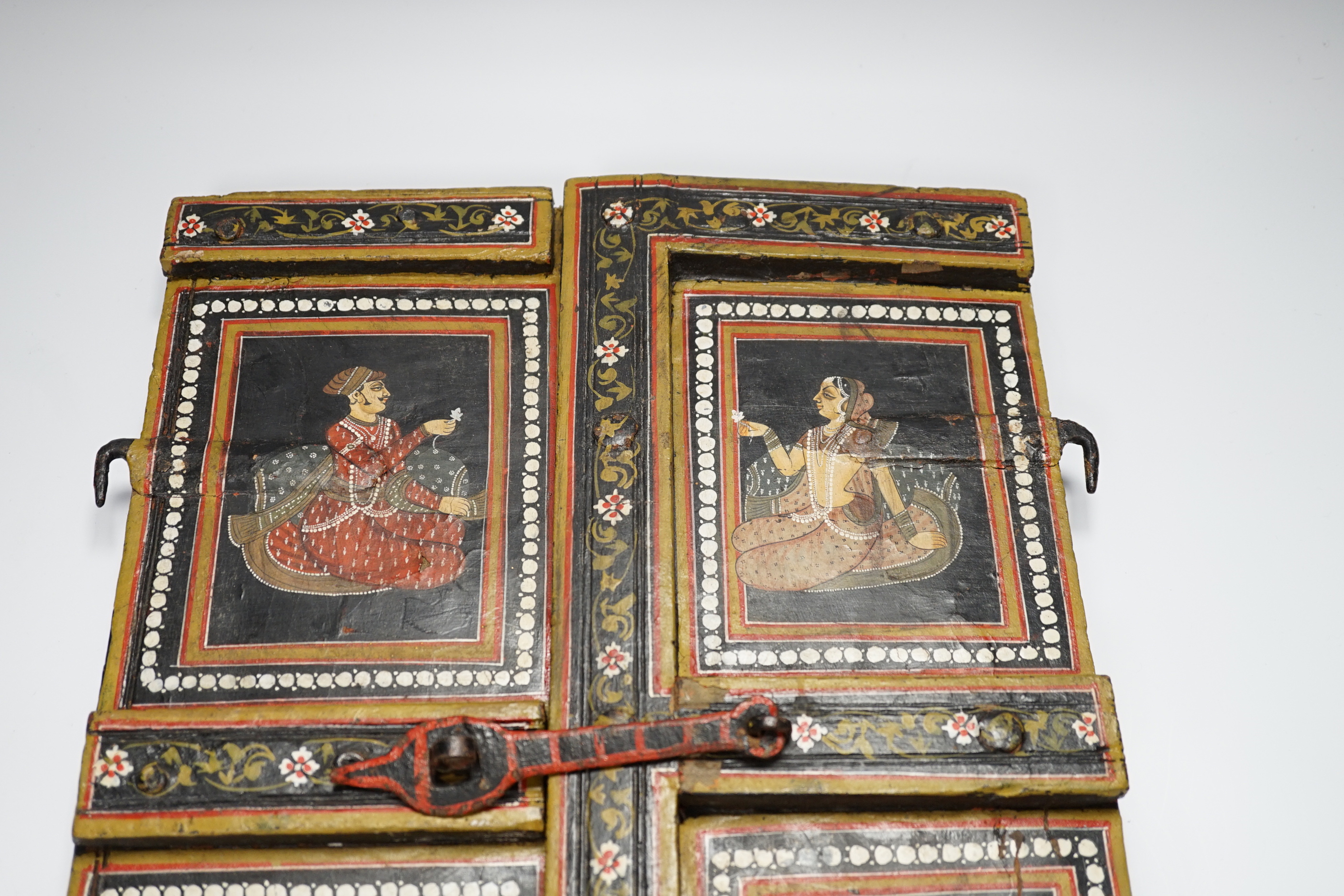 A pair of 19th century Indian figural painted door panels, 44cm high